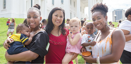(L-R): Michelle Hood and son Mason, Natalie Richie and daughter Anna and Natodisha Dixon and son Aubrey take part in Richmond, Va.'s “Big Latch On”. The event to encourage breastfeeding, was held on the State Capitol grounds in celebration of World Breastfeeding Week. Area hospitals joined the city in staging the event. Photo/James Haskins/Richmond Free Press.